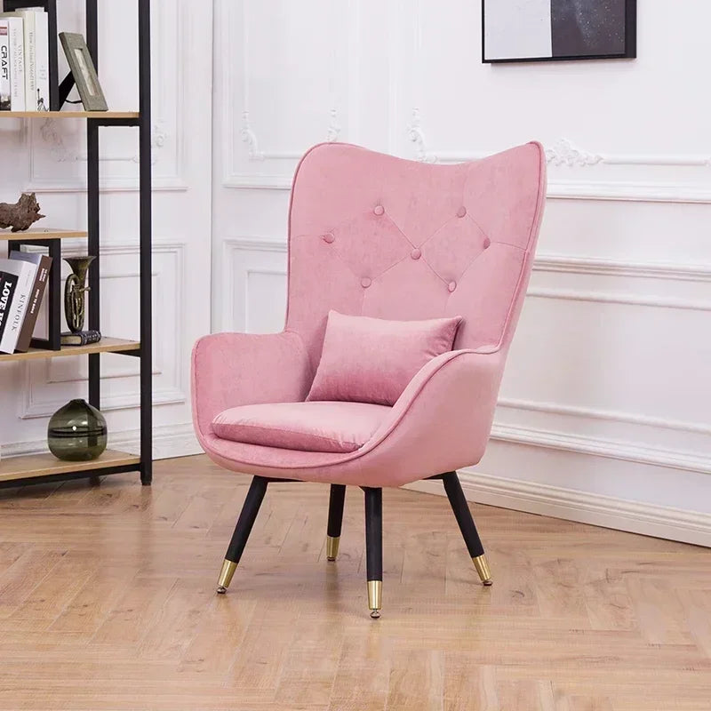 Fauteuil de lecture vintage rose avec pattes noires dorées-1